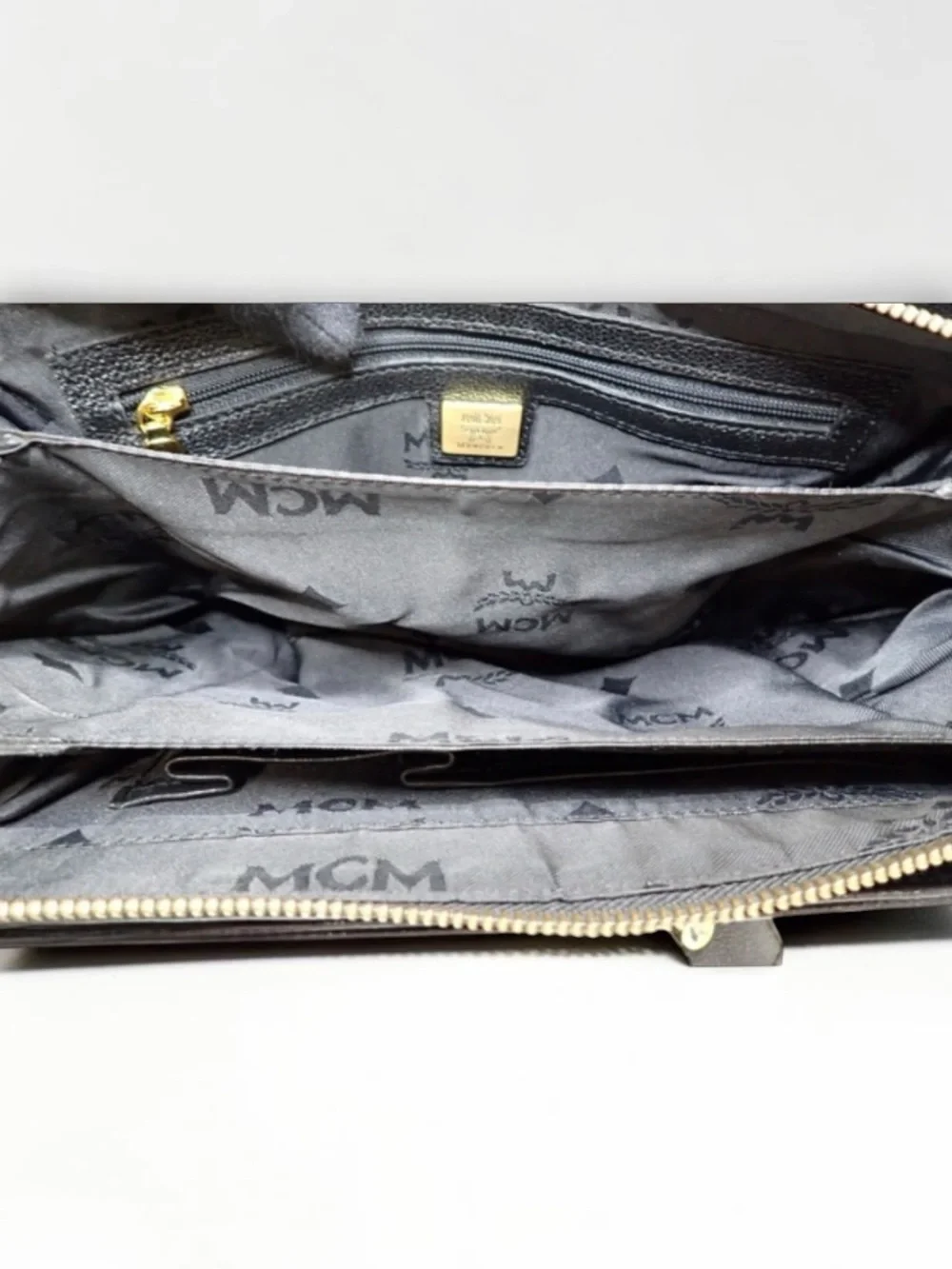 MCM Black Leather Satchel with Gold Hardware Accents